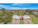 Aerial view of a house with golf course view and a beautiful desert neighborhood at 10224 E Michigan Ave, Sun Lakes, AZ 85248
