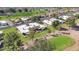 Beautiful aerial view showcasing the condo, golf course, nearby homes and lake views at 10224 E Michigan Ave, Sun Lakes, AZ 85248