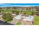 Aerial view of house with golf course view and beautiful desert neighborhood at 10224 E Michigan Ave, Sun Lakes, AZ 85248