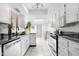 Modern kitchen features white cabinets, stainless steel appliances, and granite counters at 10224 E Michigan Ave, Sun Lakes, AZ 85248