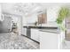 Well lit kitchen with nice white cabinets, stainless appliances, and granite counter tops at 10224 E Michigan Ave, Sun Lakes, AZ 85248