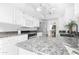 Bright kitchen with granite counters, stainless appliances, and nice white cabinets at 10224 E Michigan Ave, Sun Lakes, AZ 85248