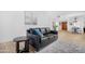 Well-lit open living room with nice wood flooring, neutral colors, and comfortable furniture at 10224 E Michigan Ave, Sun Lakes, AZ 85248