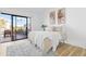 Inviting primary bedroom with neutral tones, patio access, and natural light at 10224 E Michigan Ave, Sun Lakes, AZ 85248