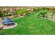 Aerial view of a green space with walking paths and a gazebo at 15409 W Corrine Dr, Surprise, AZ 85379