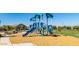 Community playground with slides, play structure, and seating at 15409 W Corrine Dr, Surprise, AZ 85379