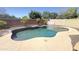 Inviting backyard pool with a pebble tec surround and mature landscaping for a private oasis at 15409 W Corrine Dr, Surprise, AZ 85379