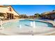 Zero entry pool with in-water fountains and lounge seating at 15409 W Corrine Dr, Surprise, AZ 85379