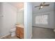 Bathroom featuring a ceiling fan, large mirror, and neutral walls at 7977 W Wacker Rd # 174, Peoria, AZ 85381