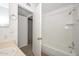 Bathroom area with tub and shower features bright white tile with modern fixtures and natural light at 7977 W Wacker Rd # 174, Peoria, AZ 85381
