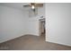 Spacious bedroom with neutral carpet, a ceiling fan, and closet at 7977 W Wacker Rd # 174, Peoria, AZ 85381