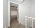 Upstairs hallway, leading to a bedroom with plush carpeting and ceiling fan at 7977 W Wacker Rd # 174, Peoria, AZ 85381