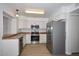 Kitchen featuring white cabinets, stainless steel appliances, and wood look countertops at 7977 W Wacker Rd # 174, Peoria, AZ 85381