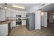 Kitchen featuring white cabinets, stainless steel appliances, and wood look countertops at 7977 W Wacker Rd # 174, Peoria, AZ 85381