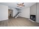 This open concept living room features wood floors, a fireplace, and neutral paint at 7977 W Wacker Rd # 174, Peoria, AZ 85381