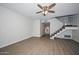 Open concept living room with modern wood floors and staircase to the upper level at 7977 W Wacker Rd # 174, Peoria, AZ 85381