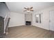 This bright living room features modern wood floors, a fireplace, and neutral paint at 7977 W Wacker Rd # 174, Peoria, AZ 85381