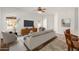 Bright living room with neutral tones, tiled floors, and a ceiling fan at 26 S Quinn Cir # 7, Mesa, AZ 85206