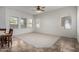 A bright living room is filled with natural light from the many windows at 26 S Quinn Cir # 7, Mesa, AZ 85206