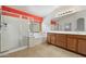 Bright bathroom features a double sink vanity, tile floors, shower and separate tub at 1392 E Baker Dr, San Tan Valley, AZ 85140