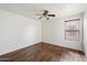 Bedroom with ceiling fan, wood-look floors, natural light and neutral walls at 1392 E Baker Dr, San Tan Valley, AZ 85140