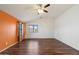 Large bedroom with ceiling fan, wood-look floors, neutral paint and natural light at 1392 E Baker Dr, San Tan Valley, AZ 85140