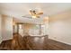 Open second story hallway with wood-look flooring, wood banister and neutral walls at 1392 E Baker Dr, San Tan Valley, AZ 85140