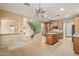 Expansive kitchen with an island, stainless steel appliances, tile backsplash, and ample counter space perfect for entertaining and cooking at 1392 E Baker Dr, San Tan Valley, AZ 85140