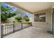 Covered patio with views of the grassy backyard and a black metal fence at 1392 E Baker Dr, San Tan Valley, AZ 85140