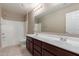 Well-lit bathroom with double sinks, a soaking tub, and tiled floors at 272 N 167Th Ln, Goodyear, AZ 85338