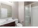 Bathroom featuring a single sink vanity and glass enclosed shower, perfect for guest bath at 272 N 167Th Ln, Goodyear, AZ 85338