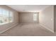 Large bedroom with carpet flooring and ample natural light from the window at 272 N 167Th Ln, Goodyear, AZ 85338