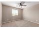 Bright, carpeted bedroom with a modern ceiling fan, and large window at 272 N 167Th Ln, Goodyear, AZ 85338