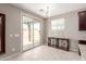 Dining area with sliding glass doors that lead to the backyard at 272 N 167Th Ln, Goodyear, AZ 85338