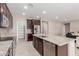 Modern kitchen features stainless steel appliances, granite countertops, and a large center island at 272 N 167Th Ln, Goodyear, AZ 85338