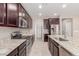 Spacious kitchen with granite countertops, stainless steel appliances, and ample cabinet space at 272 N 167Th Ln, Goodyear, AZ 85338