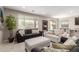 Cozy living room with large windows offering natural light and a view at 272 N 167Th Ln, Goodyear, AZ 85338