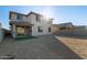 Two story home with gravel backyard and small turf area at 18424 W Monte Lindo Ln, Surprise, AZ 85387