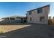 Two story home with gravel backyard and small turf area at 18424 W Monte Lindo Ln, Surprise, AZ 85387