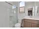 Modern bathroom with walk-in shower and vanity at 18424 W Monte Lindo Ln, Surprise, AZ 85387