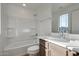 Clean bathroom with single sink vanity and shower/tub at 18424 W Monte Lindo Ln, Surprise, AZ 85387