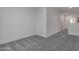 Spacious bedroom with grey carpeting at 18424 W Monte Lindo Ln, Surprise, AZ 85387