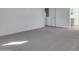 Spacious bedroom with grey carpet and ample wall space at 18424 W Monte Lindo Ln, Surprise, AZ 85387
