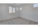 Spacious bedroom featuring neutral walls and carpet at 18424 W Monte Lindo Ln, Surprise, AZ 85387