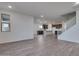 Open concept living room with kitchen and island visible at 18424 W Monte Lindo Ln, Surprise, AZ 85387