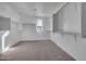 Large walk-in closet with ample shelving and hanging space at 18424 W Monte Lindo Ln, Surprise, AZ 85387