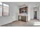 Convenient wet bar with microwave and mini-fridge at 18424 W Monte Lindo Ln, Surprise, AZ 85387