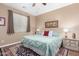Spacious bedroom with large bed, nightstands, and window coverings at 7156 S Forest Ave, Gilbert, AZ 85298