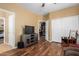 Spacious bedroom with wood floors and access to another room at 7156 S Forest Ave, Gilbert, AZ 85298
