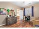 Bright bedroom with a dresser and built-in shelving at 7156 S Forest Ave, Gilbert, AZ 85298